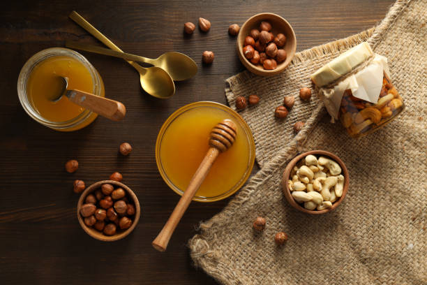 Concept of tasty and sweet food honey with nuts