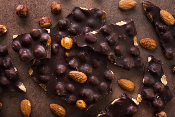 Bar of black chocolate with nuts and almonds